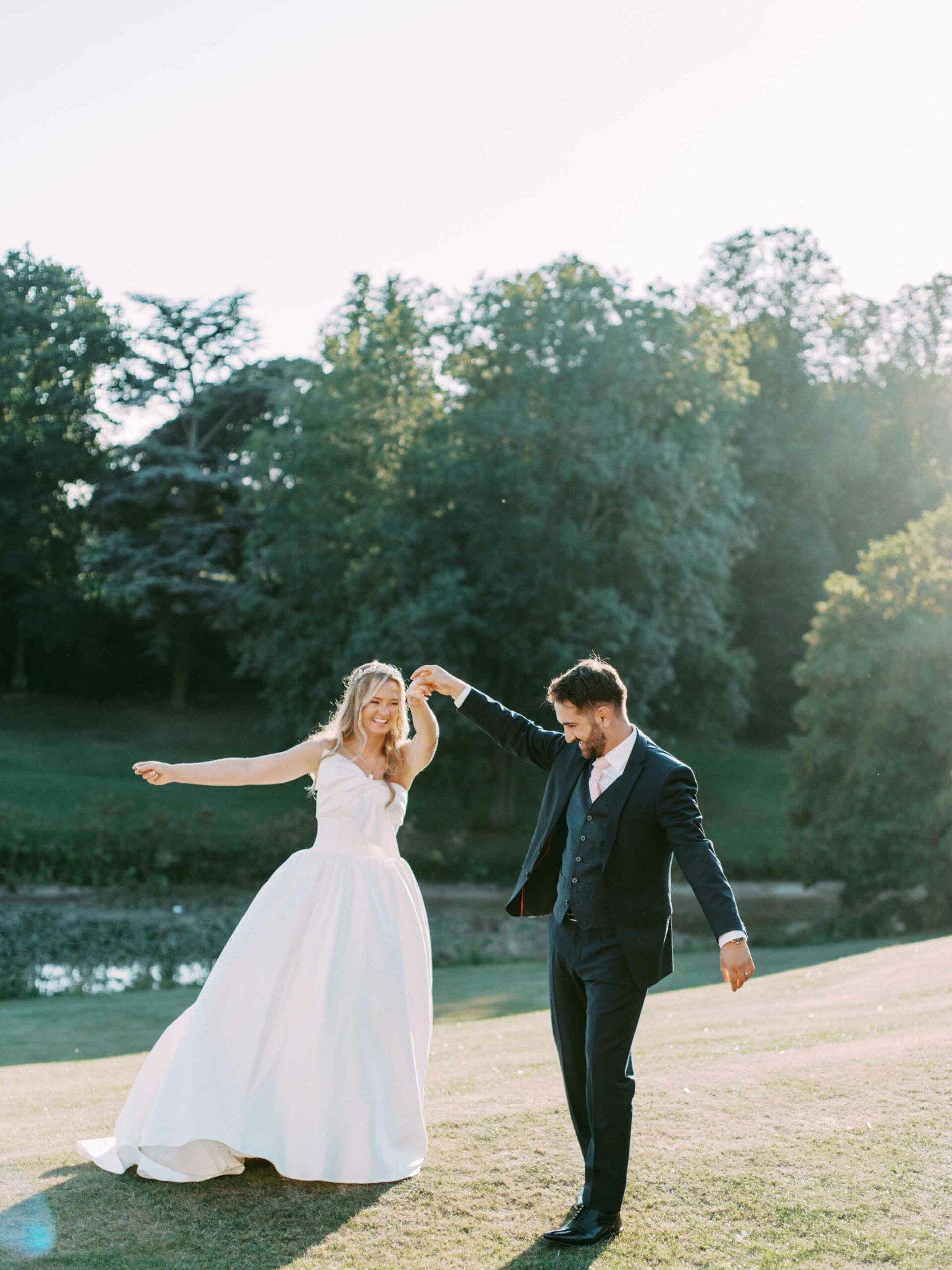 bride and groom dancing outside at wynyard hall