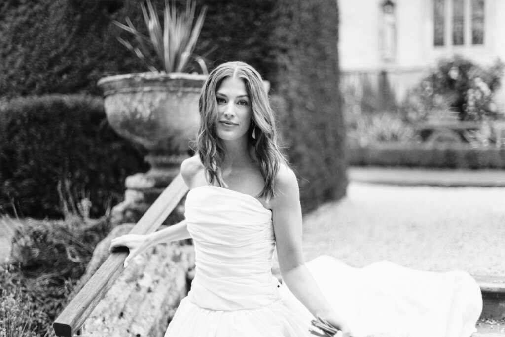  Bride holding white bouquet at Sudeley Castle wedding